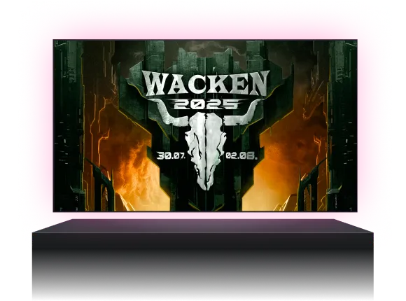 Bildschirm mit Logo des Wacken Open Air 2025 und den Festivaldaten 30.07.-02.08.